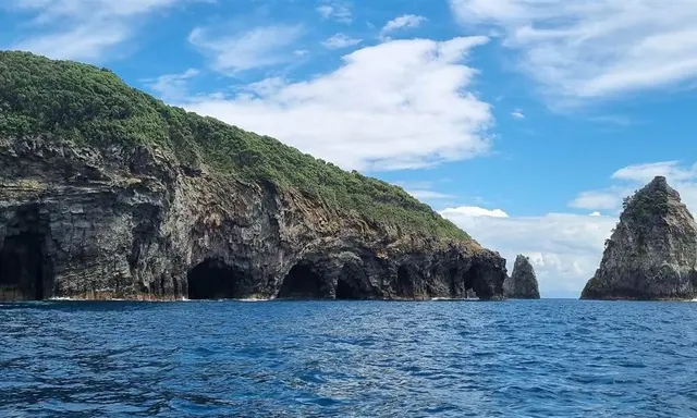 Tūhua by Yacht: Volcanic Shores and an Island Visit by Arrangement