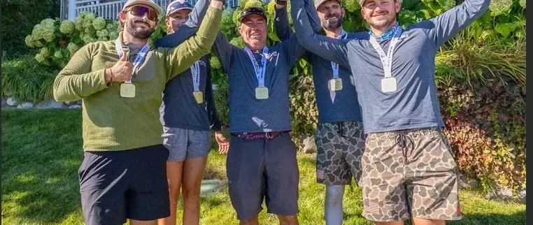 Official image supplied by International Melges 24 Class Association / Zerogradinord — official photograph of Wah Gwan world championship crew celebrating at Harbor Springs.